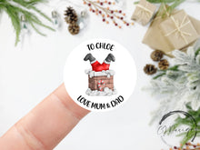 Load image into Gallery viewer, Personalised Christmas Sticker Gift Tags with Santa in Chimney - Round Name Gift Labels - Festive Christmas Tag -37mm or 51mm Childrens Kids
