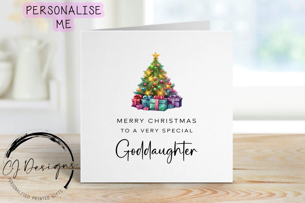 Goddaughter Chirstmas card with a picture of a colourful Christmas tree with gifts underneath