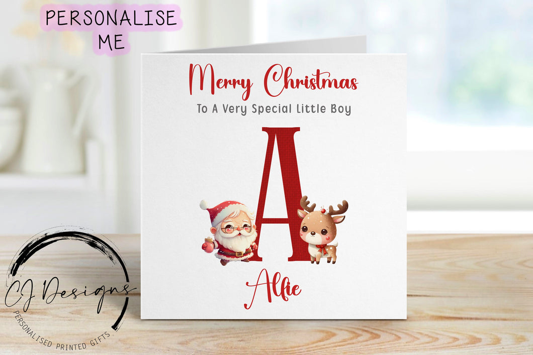 Little Boy christmas card with a picture of santa with his reindeer and a large single red letter which depicts thefirst letter of the childs name