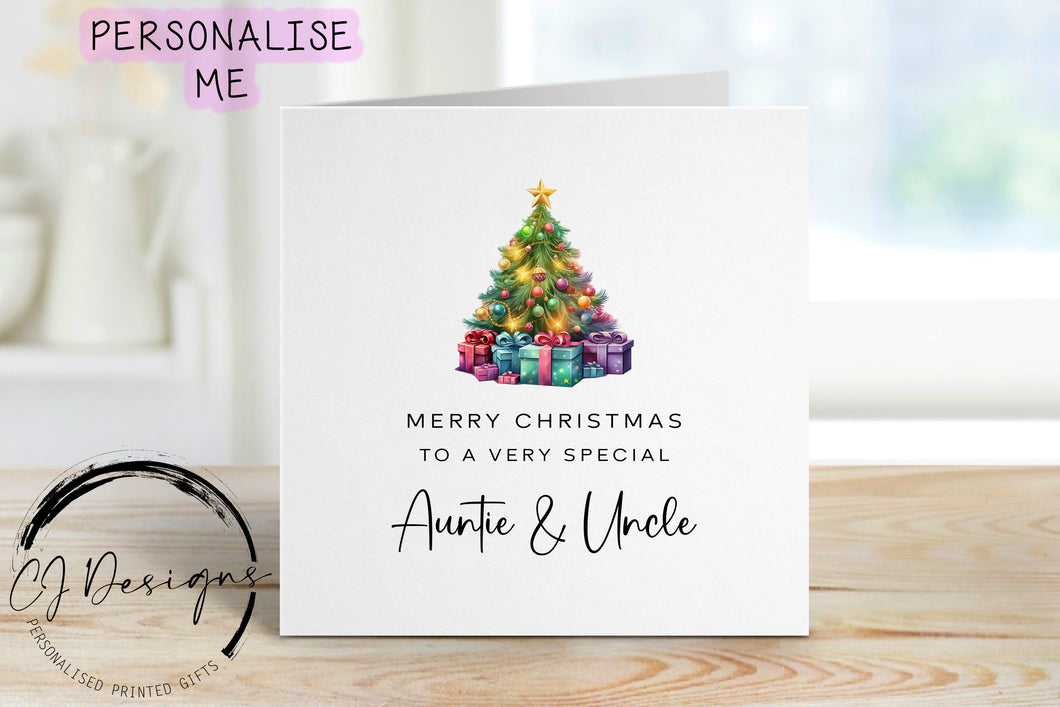 Auntie & Uncle chirstmas card with a picture of a colourful Christmas tree with gifts underneath