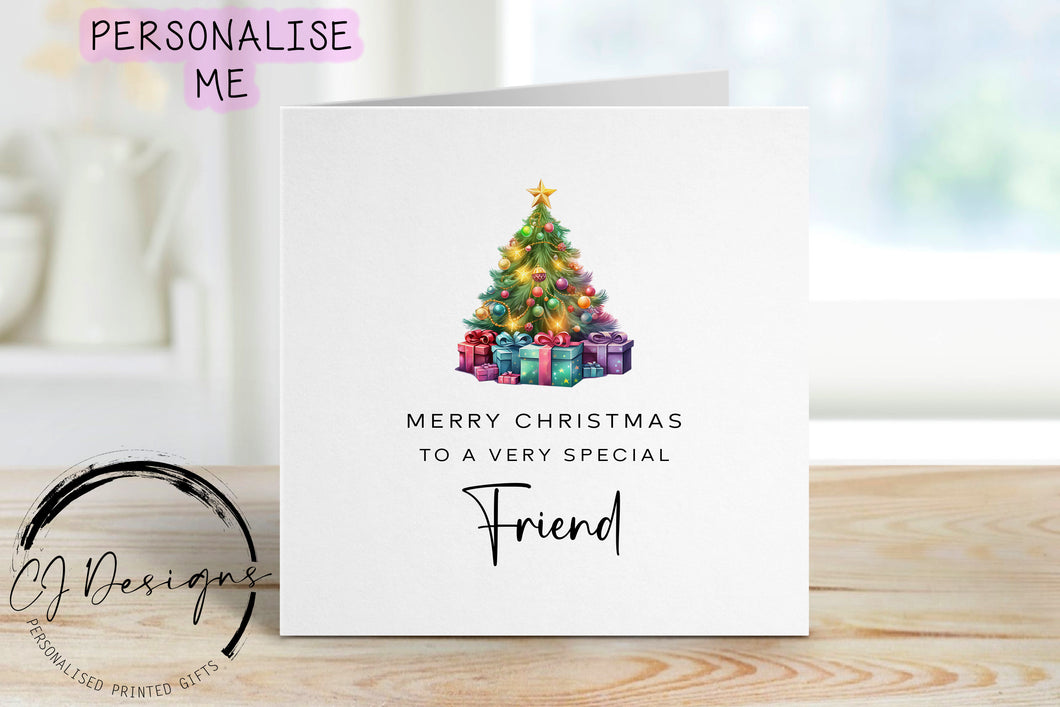 Friend chirstmas card with a picture of a colourful Christmas tree with gifts underneath