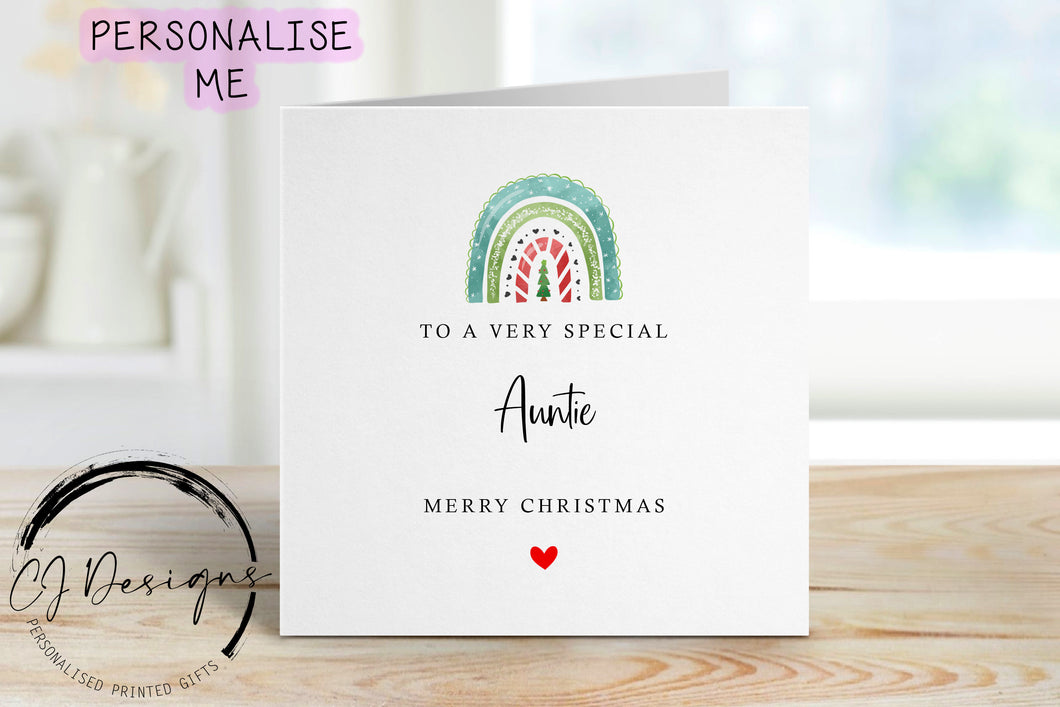 Auntie Christmas card with a green christmas themed rainbow with a christmas tree in the center