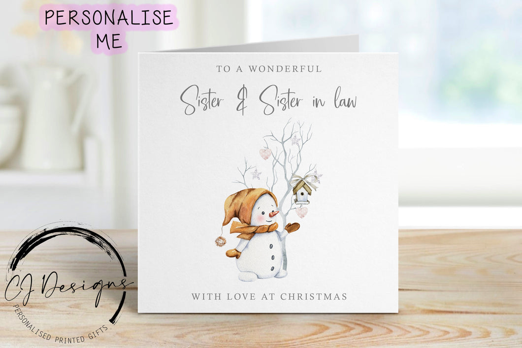 Wonderful Sister & Sister in law Christmas Card with picture of a snowman next to a stick tree with stars and hearts